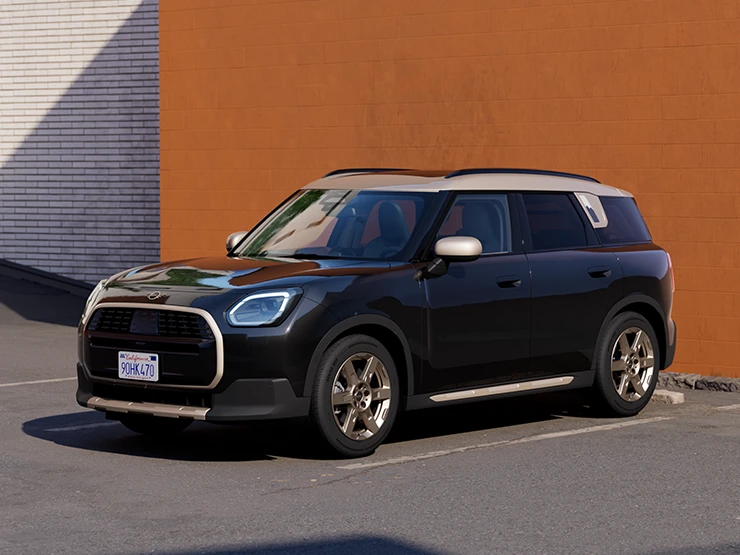 Priekšskats ar MINI Countryman Midnight Black krāsā ar Vibrant Silver jumtu, kas novietots stāvvietā.